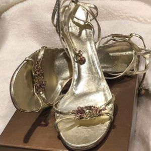 Authentic Gucci Gold strap sandals.